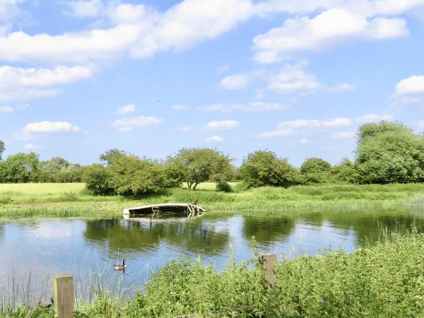 A view over one of the lakes toward an old upturned boat